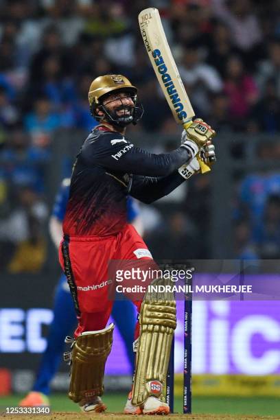 Royal Challengers Bangalore's Dinesh Karthik plays a shot during the Indian Premier League Twenty20 cricket match between Mumbai Indians and Royal...