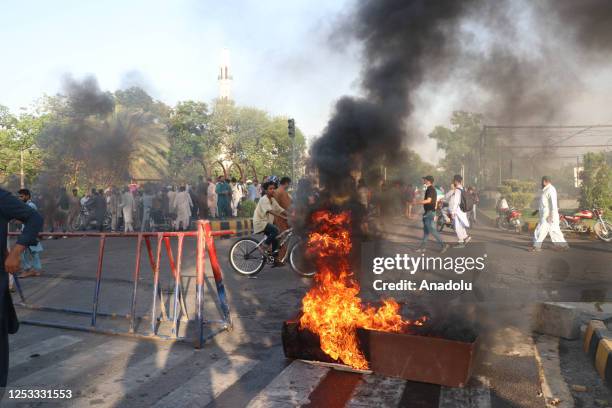 Pakistani police use teargas shells against the supporters of Former Prime Minister Imran Khan and political party Pakistan Tehreek-e-Insaf during a...