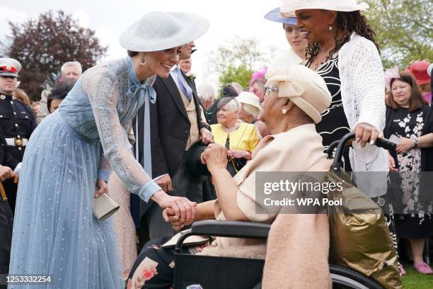 Catherine, Princess of Wales speaks to Aldith Grandison and daughter Jay Cee La Bouche during a Garden Party at a celebration of the coronation at...