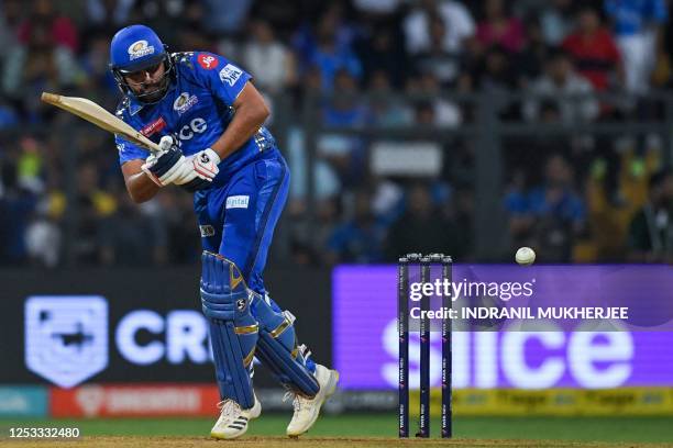 Mumbai Indians' Rohit Sharma plays a shot during the Indian Premier League Twenty20 cricket match between Mumbai Indians and Royal Challengers...