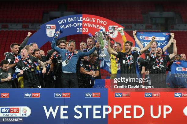 Northampton Town celebrate winning the Sky Bet League Two Play Off Final between Exeter City v Northampton Town at Wembley Stadium on June 29, 2020...