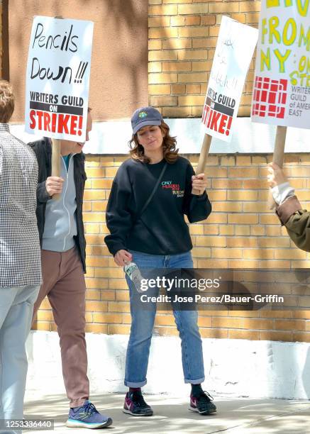 Tina Fey is seen holding signs in support of the Writers Guild of America strike outside the Silvercup Studios on May 09, 2023 in New York City.