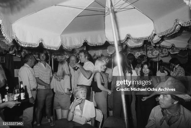 American actors Clint Eastwood and John Quade at the Palomino Club in North Hollywood, California, during a party for the film 'Any Which Way You...