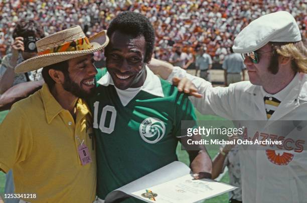 From left to right, musician Sergio Mendes, soccer player Pelé of the New York Cosmos and singer Elton John in Los Angeles, before the start of a...