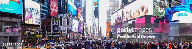 Thousands of tourists are seen in Times Square on December 24, 2019 in New York City. Times Square is a major commercial intersection, tourist...
