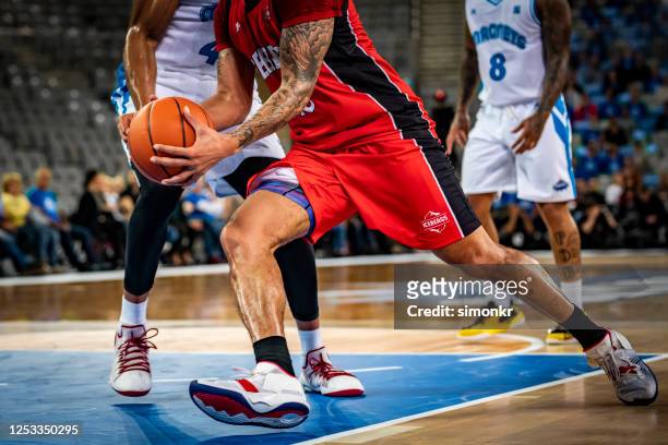basketball players tackling for ball - basketball sport team stock pictures, royalty-free photos & images