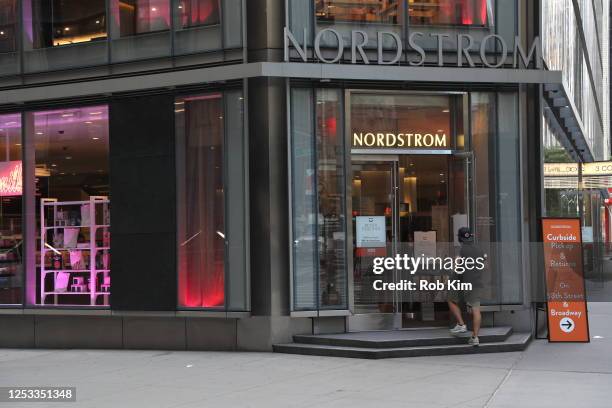 Person walks into the Nordstrom store open for business as New York City moves into Phase 2 of re-opening following restrictions imposed to curb the...