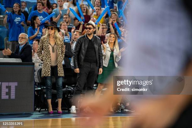 celebrities watching basketball match - vip sports event stock pictures, royalty-free photos & images