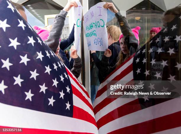 Demonstrators rally outside the North Carolina Legislative Building on Wednesday, May 3 after Republican lawmakers announced their plan to limit...