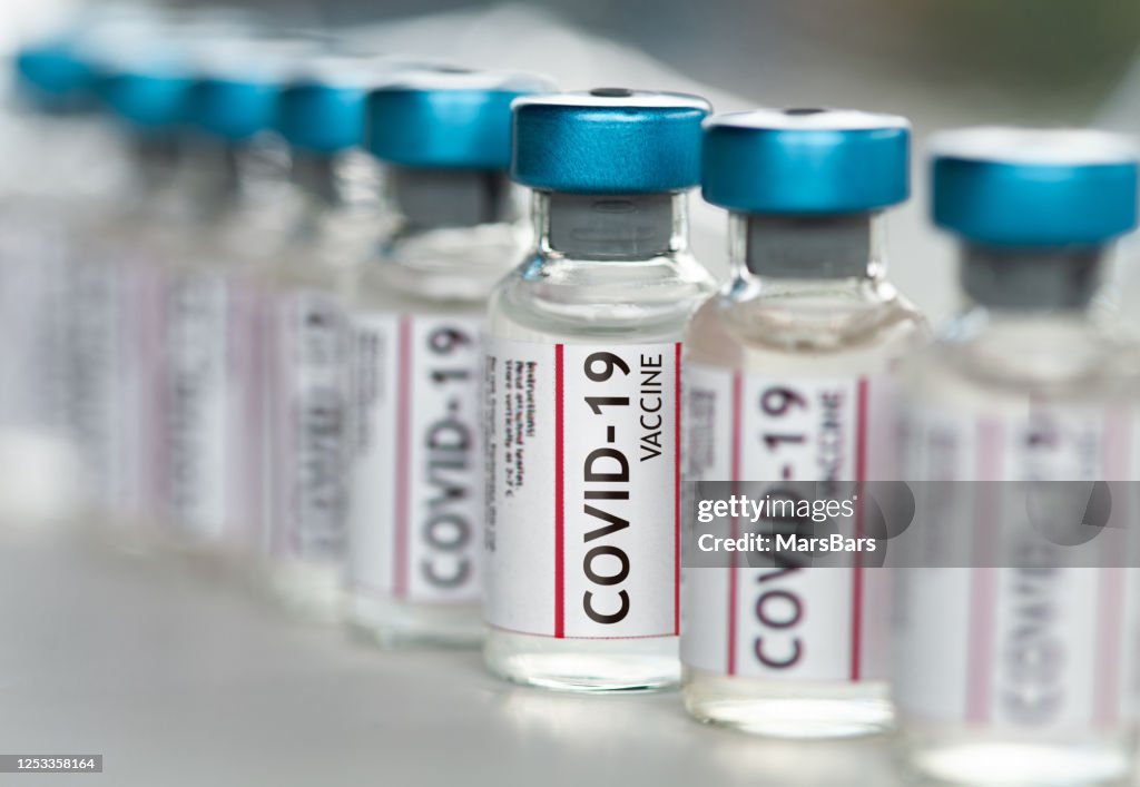 Covid-19 Coronavirus Vaccine vials in a row macro close up