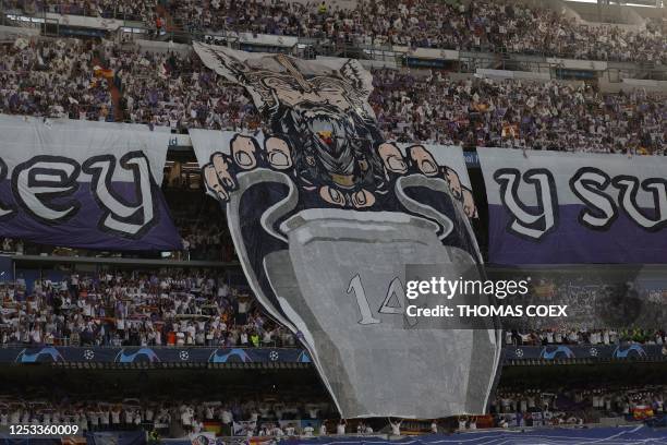 Manchester City's supporters cheer during the UEFA Champions League semi-final first leg football match between Real Madrid CF and Manchester City at...