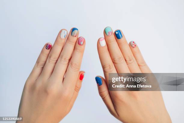 playful abstract summer manicure - multi coloured nails stock pictures, royalty-free photos & images