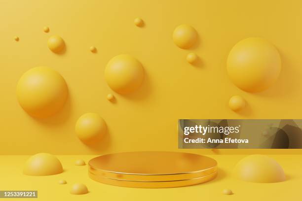 golden podium on yellow background with spheres. perfect for beuty products demonstration. - 3d background fotografías e imágenes de stock