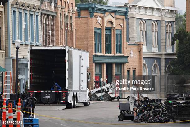 Worker moves cables on set at Warner Brothers Studios on December 14 in Los Angeles, California. The 110-acre main lot and nearby 32-acre Ranch...