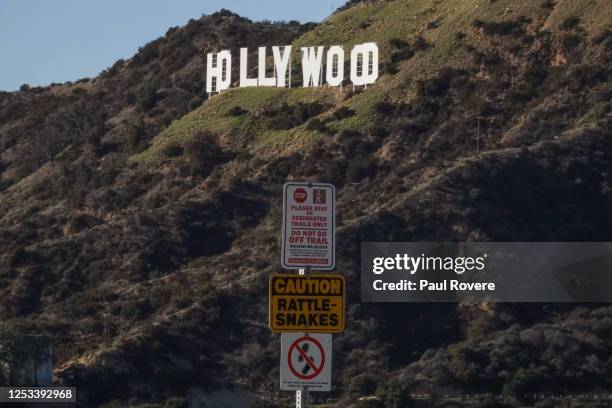 Warning signs on the trail to the Hollywood sign caution against leaving the trail and rattlesnakes on December 15 in Los Angeles, California....