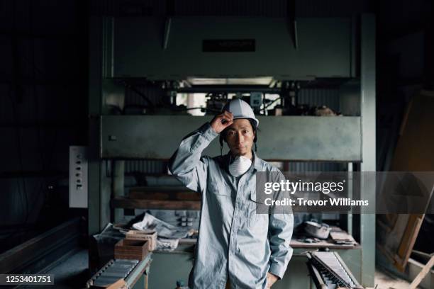 portrait of a blue collar factory worker in japan - masculinity stock pictures, royalty-free photos & images