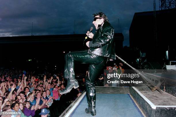 Bono of U2 performs during the Zoo TV tour at Earls Court on May 31st 1992