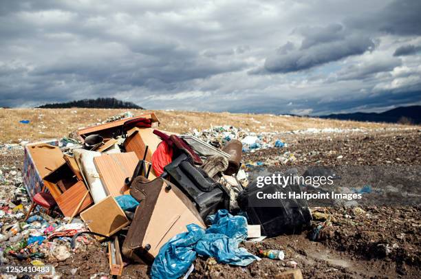 old furniture on landfill, waste management and environmental concept. - nuclear waste management stock pictures, royalty-free photos & images