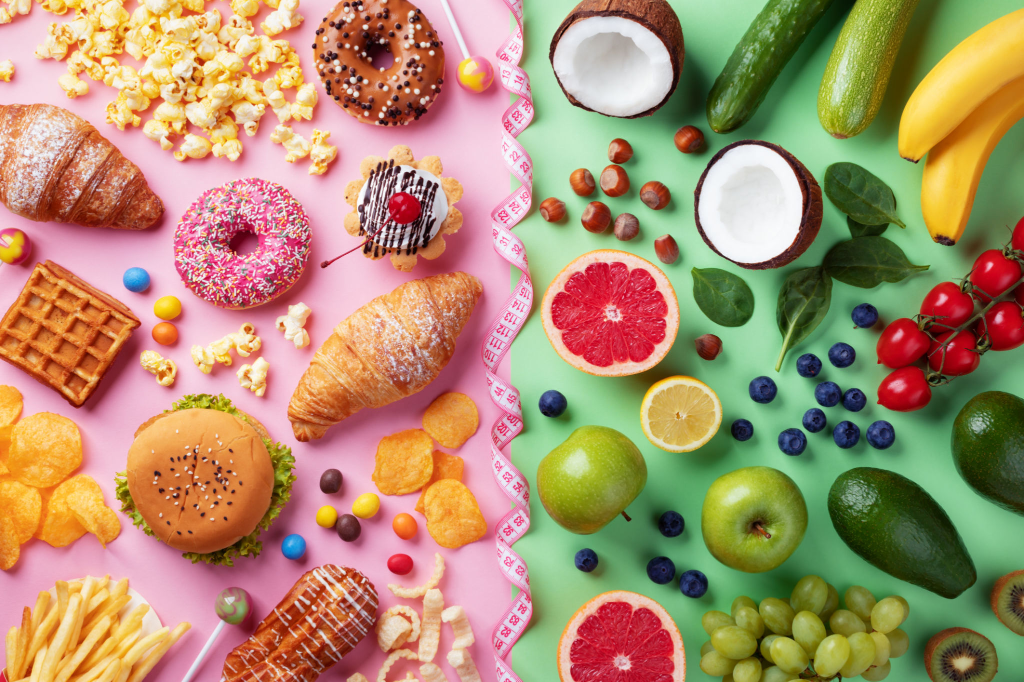 Healthy and unhealthy food background from fruits and vegetables vs fast food, sweets and pastry top view. Diet and detox against calorie and overweight lifestyle concept. Healthy and unhealthy food background from fruits and vegetables vs fast food, sweets and pastry top view. Diet and detox against calorie and overweight lifestyle concept.