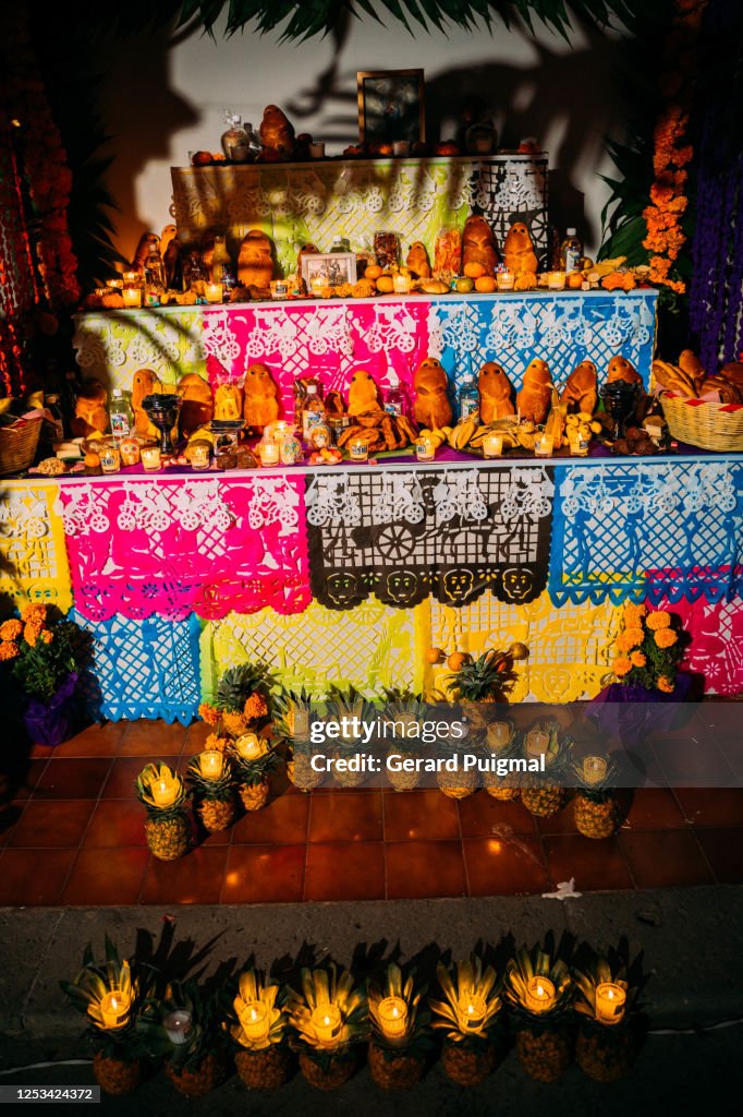 Altar decorated with the favourite foods and beverages of the deceased in Oaxaca during Day of The Dead
