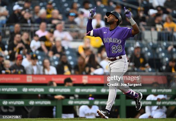 Jurickson Profar of the Colorado Rockies celebrates his solo home run during the second inning against the Pittsburgh Pirates at PNC Park on May 9,...