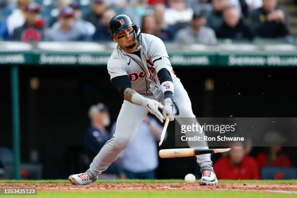 Javier Baez of the Detroit Tigers breaks his bat as he grounds off Shane Bieber of the Cleveland Guardians during the third inning at Progressive...