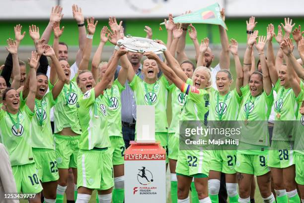 Players of Wolfsburg celebrate with trophy after wining championship following the Flyeralarm Frauen Bundesliga match between VfL Wolfsburg Women's...