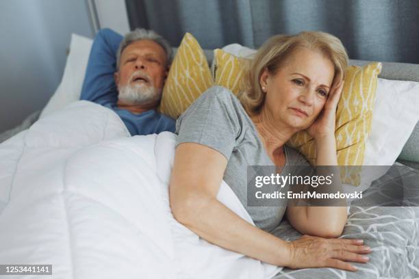 snoring is a serious problem for the second person - snoring husband stock pictures, royalty-free photos & images