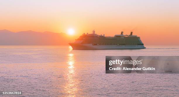 cruise ship at sea at sunrise - cruise view stock pictures, royalty-free photos & images