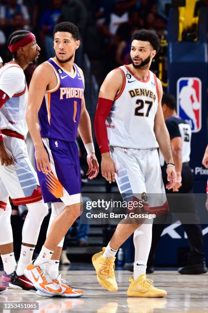 Devin Booker of the Phoenix Suns and Jamal Murray of the Denver Nuggets look on during Game Five of the Western Conference Semi-Finals of the 2023...