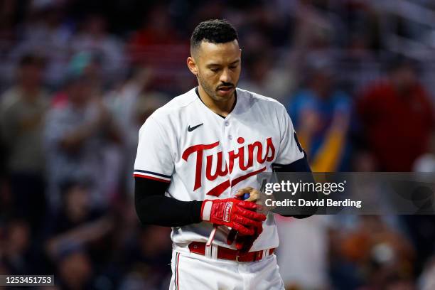 Carlos Correa of the Minnesota Twins reacts to striking out against the San Diego Padres in the seventh inning at Target Field on May 9, 2023 in...