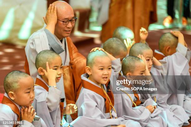 South Korean child monks attend an event to celebrate the upcoming Buddha's birthday at Jogye Temple in Seoul. Young children are annually invited to...