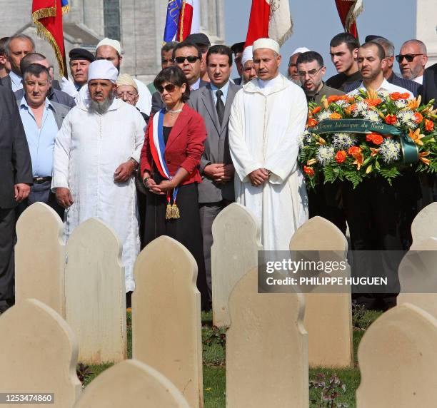 People spend moments in silence at the military cemetary of Notre-Dame-de-Lorette, in Ablain-Saint-Nazaire near Arras, Northern France, 20 April...