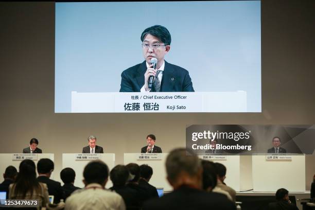 Koji Sato, president of Toyota Motor Corp., center, speaks during a news conference in Tokyo, Japan, on Wednesday, May 10, 2023. The world's largest...