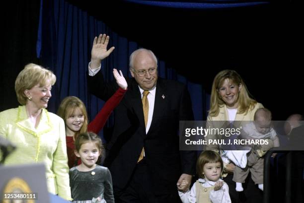 Vice President Dick Cheney walks on stage with his family 03 November 2004 at the Ronald Reagan Building in Washington, DC before US President George...