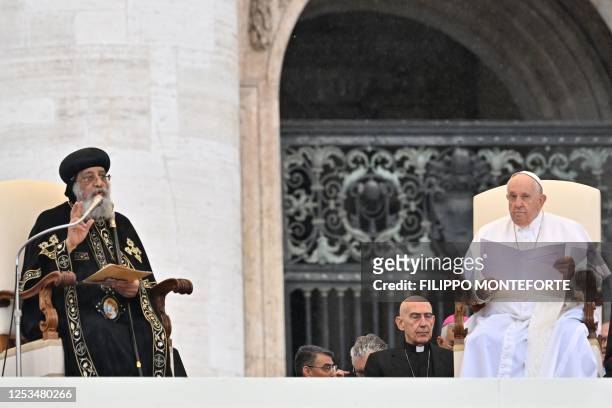Leader of the Coptic Orthodox Church of Alexandria, Pope Tawadros II speaks as Pope Francis looks on at the start of the weekly general audience on...