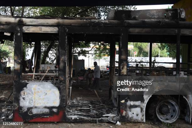 View of burnt bus after protesters clash with police as Pakistan Tehreek-e-Insaf protesters gather to protest against arrest of Pakistan's ex-premier...
