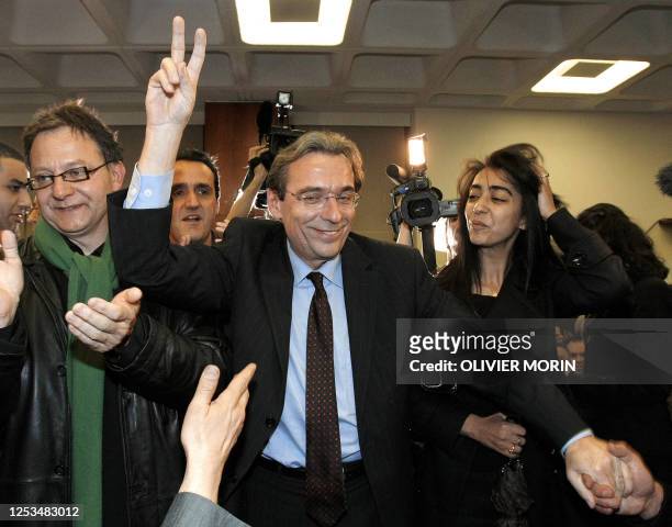 French socialist candidate for Strasbourg's townhall and former mayor Roland Ries celebrates on March 16 after his election following the final round...