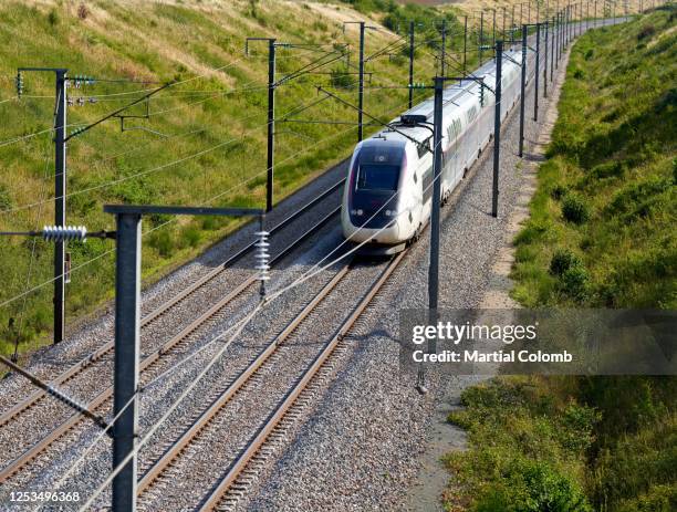 high speed train on a railway track - train france stock pictures, royalty-free photos & images