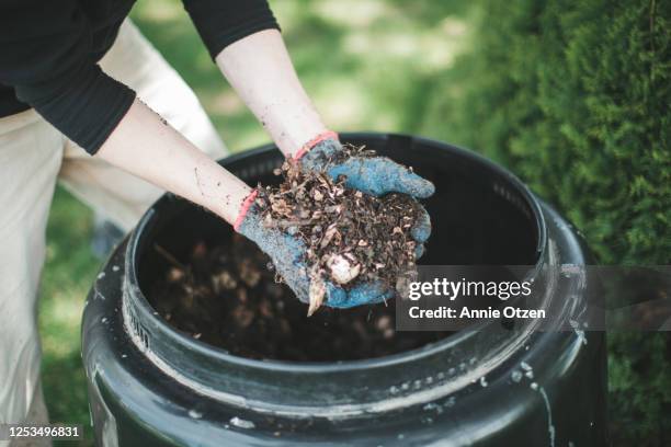 man showing compost - compost bin stock pictures, royalty-free photos & images