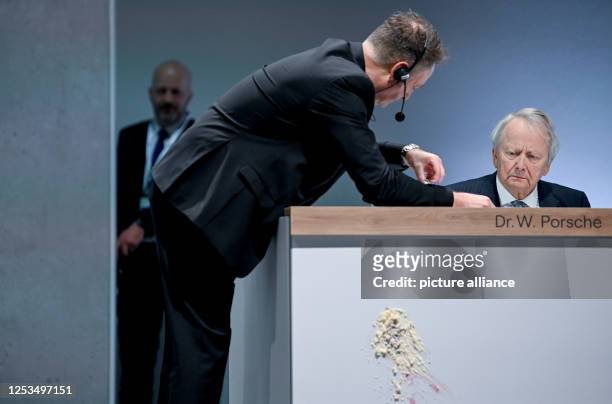 Wolfgang Porsche, Chairman of the Supervisory Board of Porsche Automobil Holding SE, sits on the podium, where you can see an imprint after a cake...