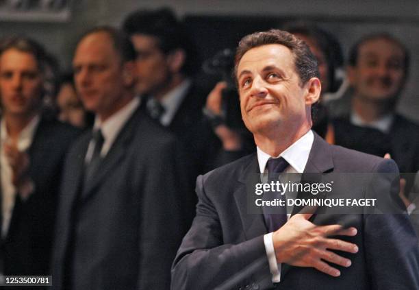 French right-wing presidential candidate of the Union for a Popular Movement Nicolas Sarkozy is applauded by supporters, 06 May 2007 at the "salle...