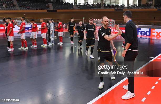 Gréllo of Sporting Anderlecht Futsal and SL Benfica head coach Mario Silva shake hands before the UEFA Futsal Champions League Finals 2022/23...