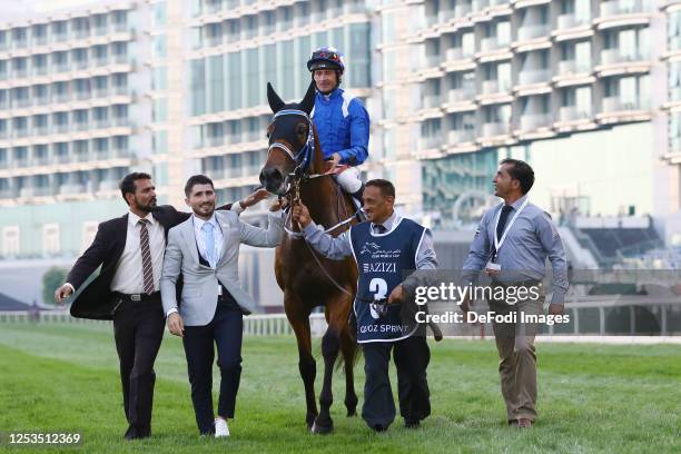 Dane O'Neill celebrates after winning the Al Qouz Sprint track during the Dubai World Cup at Meydan Racecourse on March 25, 2023 in Dubai, United...