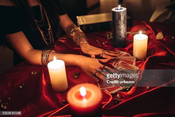 fortune teller reading tarot - ceremony stock pictures, royalty-free photos & images