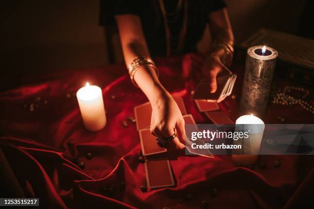 fortune teller reading tarot - tarot cards stock pictures, royalty-free photos & images