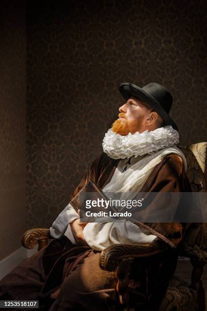 redhead traditional dutch man reading a book - duke painting stock pictures, royalty-free photos & images