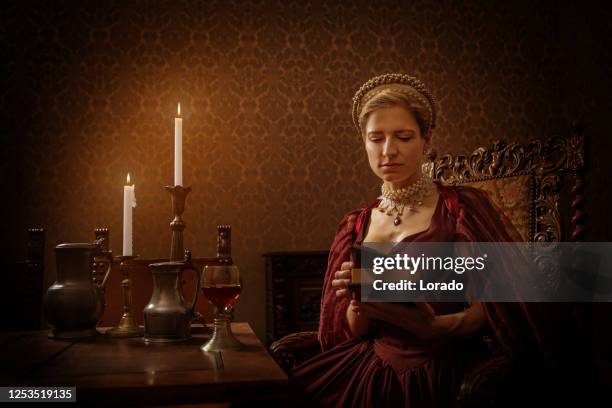 portrait of a beautiful historical dutch noble woman by candlelight - 17th century style stock pictures, royalty-free photos & images