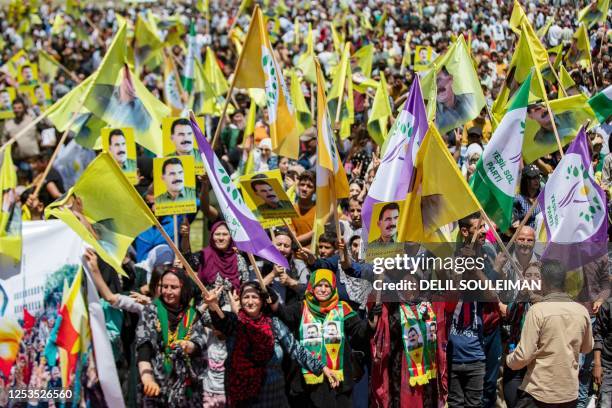 Thousands of Syrian Kurds protest in Qamishli in northeastern Syria on May 10, 2023 against Turkish President Recep Tayyip Erdogan in a show of...