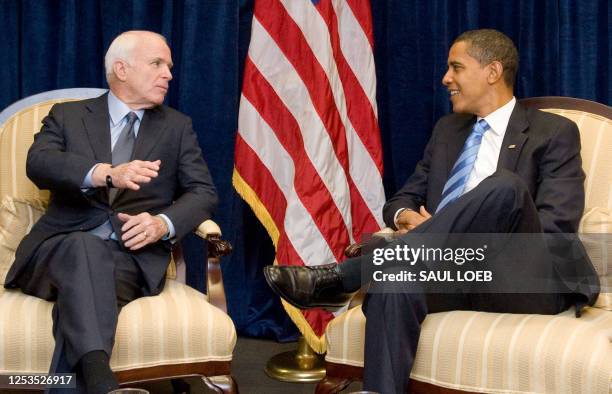 President-elect Barack Obama speaks with former Republican presidential candidate Arizona Senator John McCain at Obama's transition offices in...
